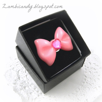 Adjustable pink bow ring