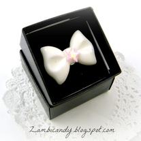 Adjustable white bow ring