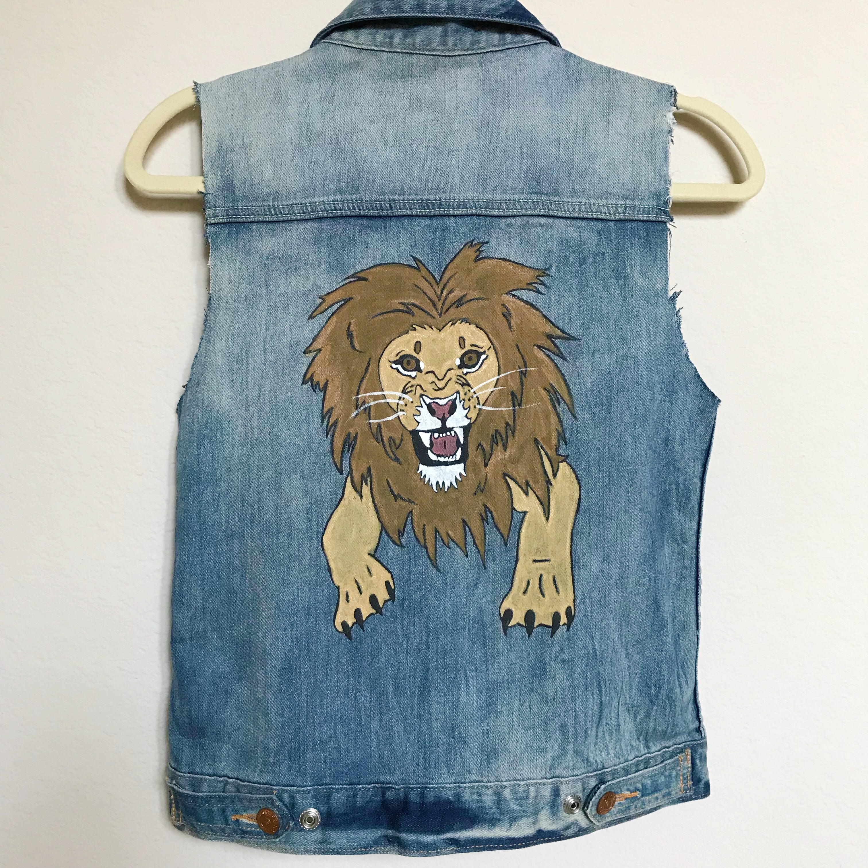 denim jacket with lion on back